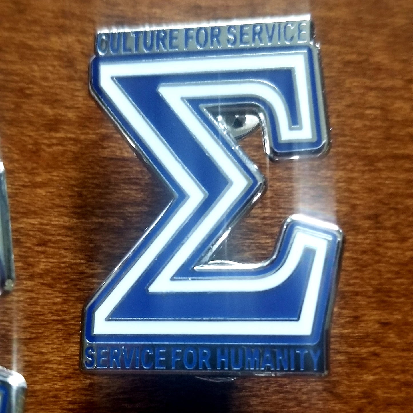 Sigma Motto lapel pin