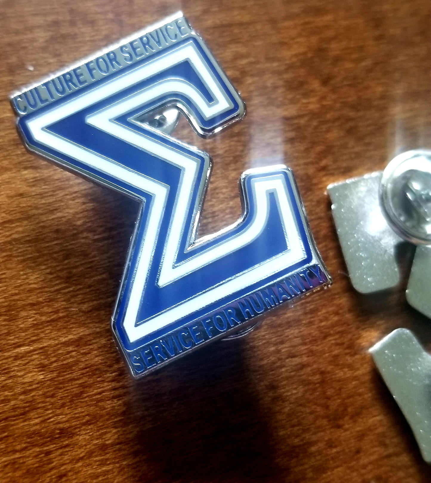 Sigma Motto lapel pin