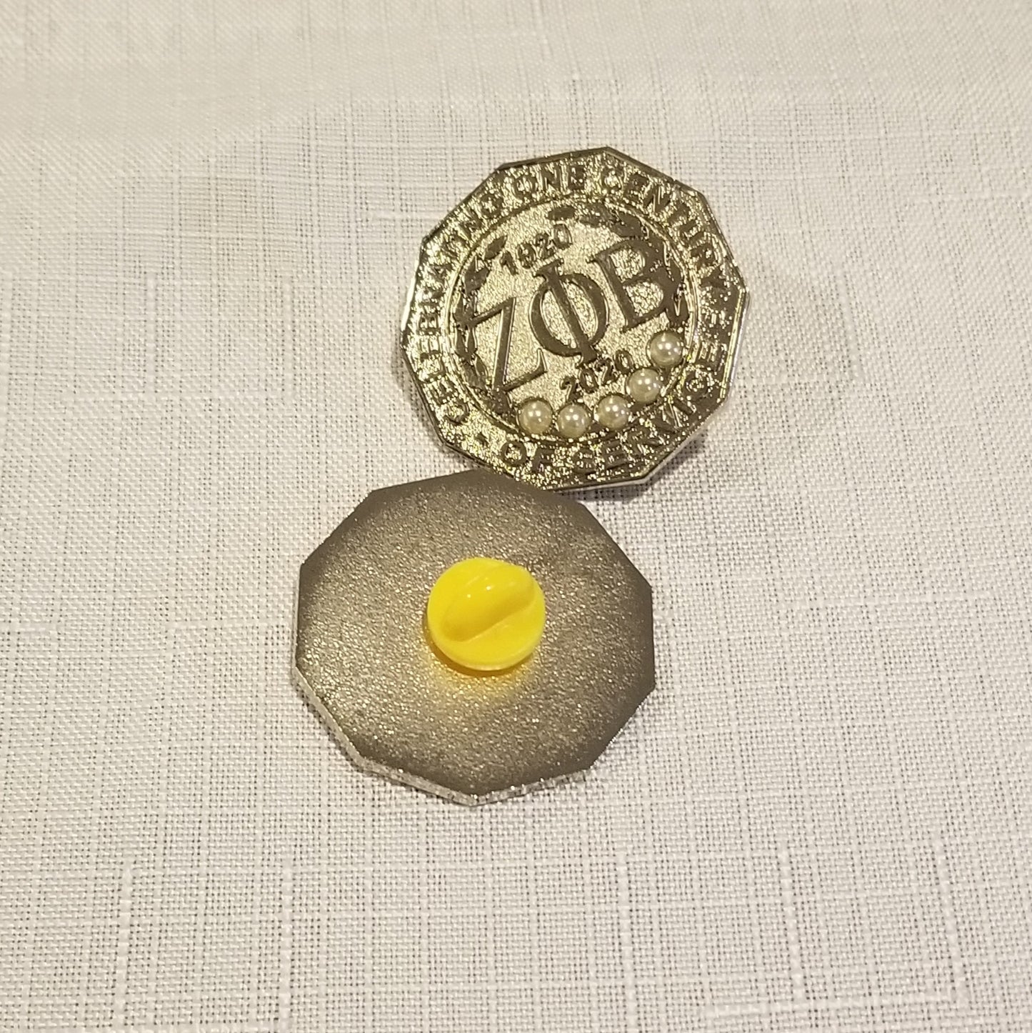 Centennial lapel pin