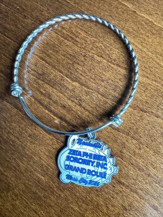 Grand Boule 2026 Pin & Bracelet Set